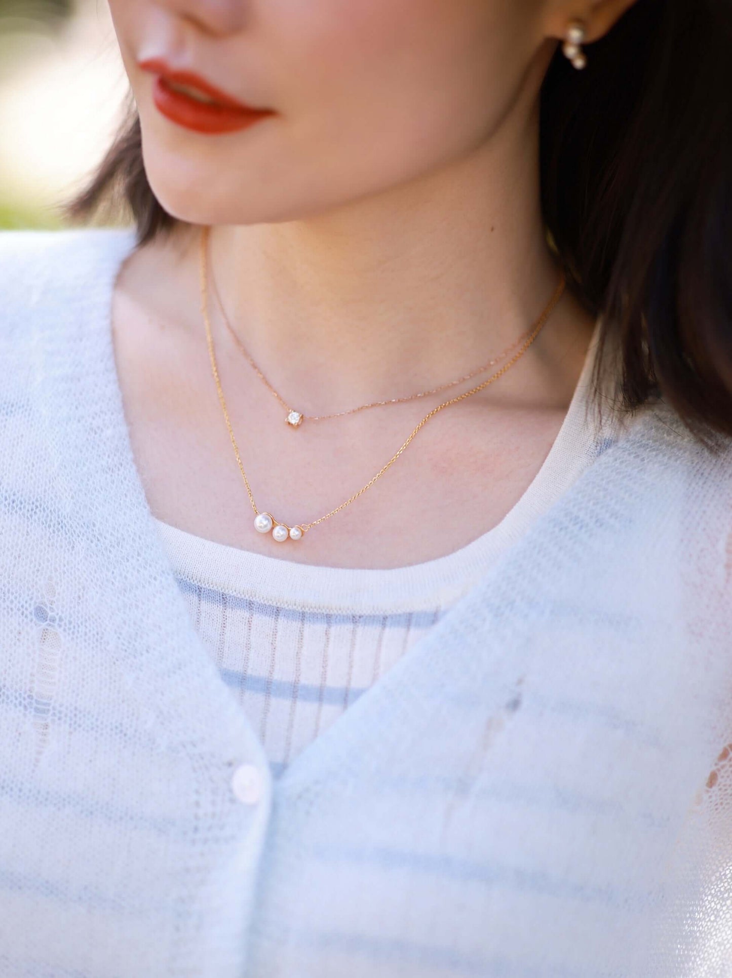 Woman wearing SUIHE Jewelry freshwater pearl necklace with 18k Gold Vermeil, showcasing elegant design.