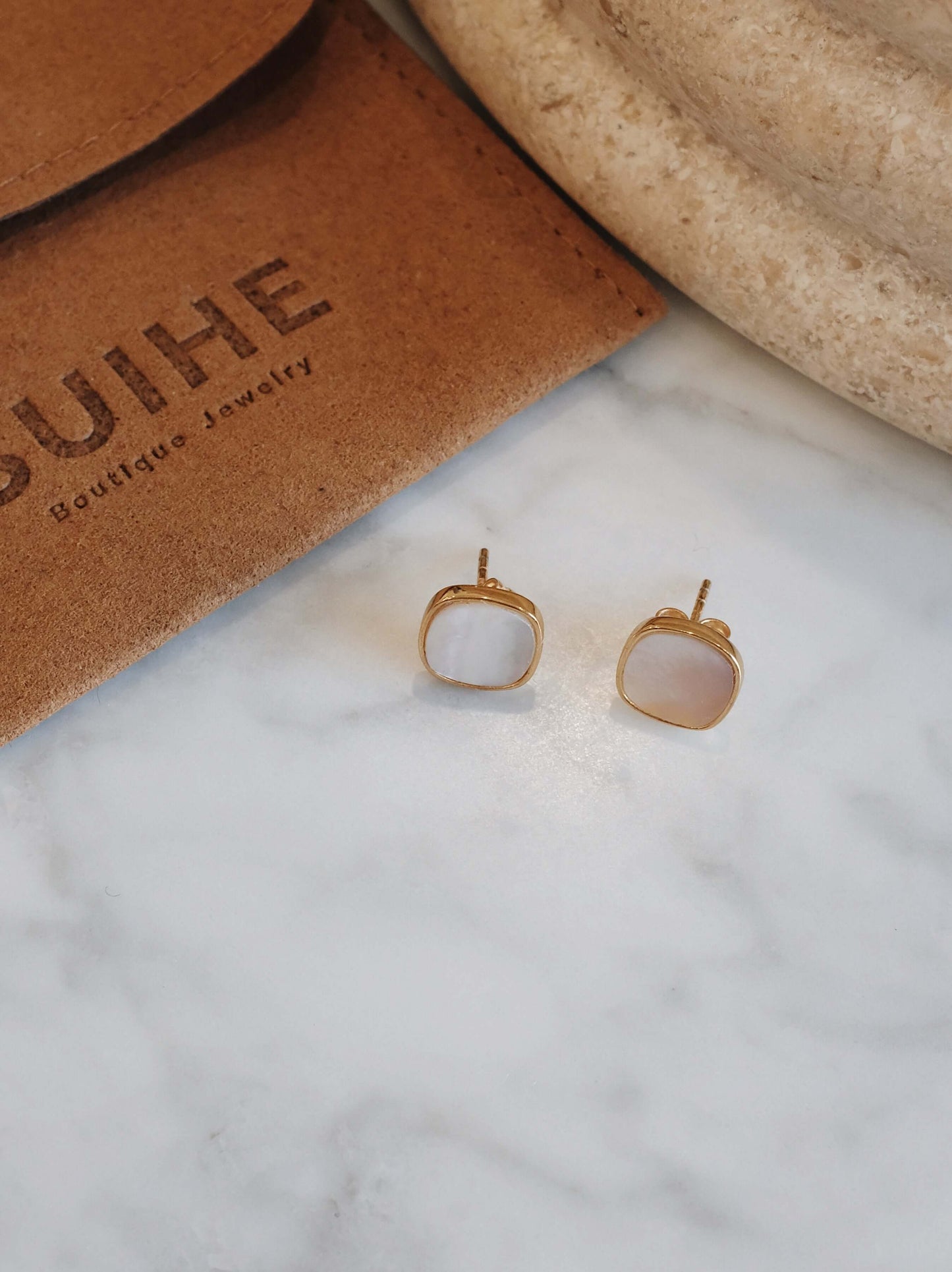 Moonlight Mother-of-Pearl Stud Earrings in 18k Gold Vermeil by SUIHE Jewelry on marble surface.