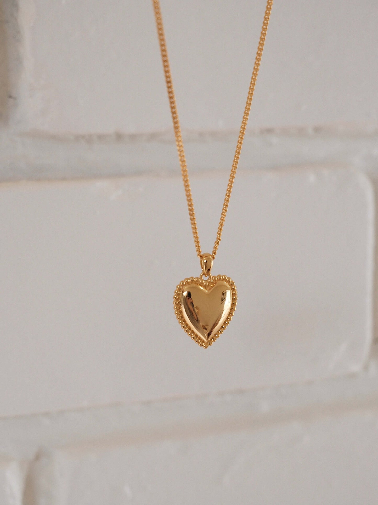 Gold-tone heart charm necklace with beaded detailing by SUIHE Jewelry, elegant accessory for any occasion.