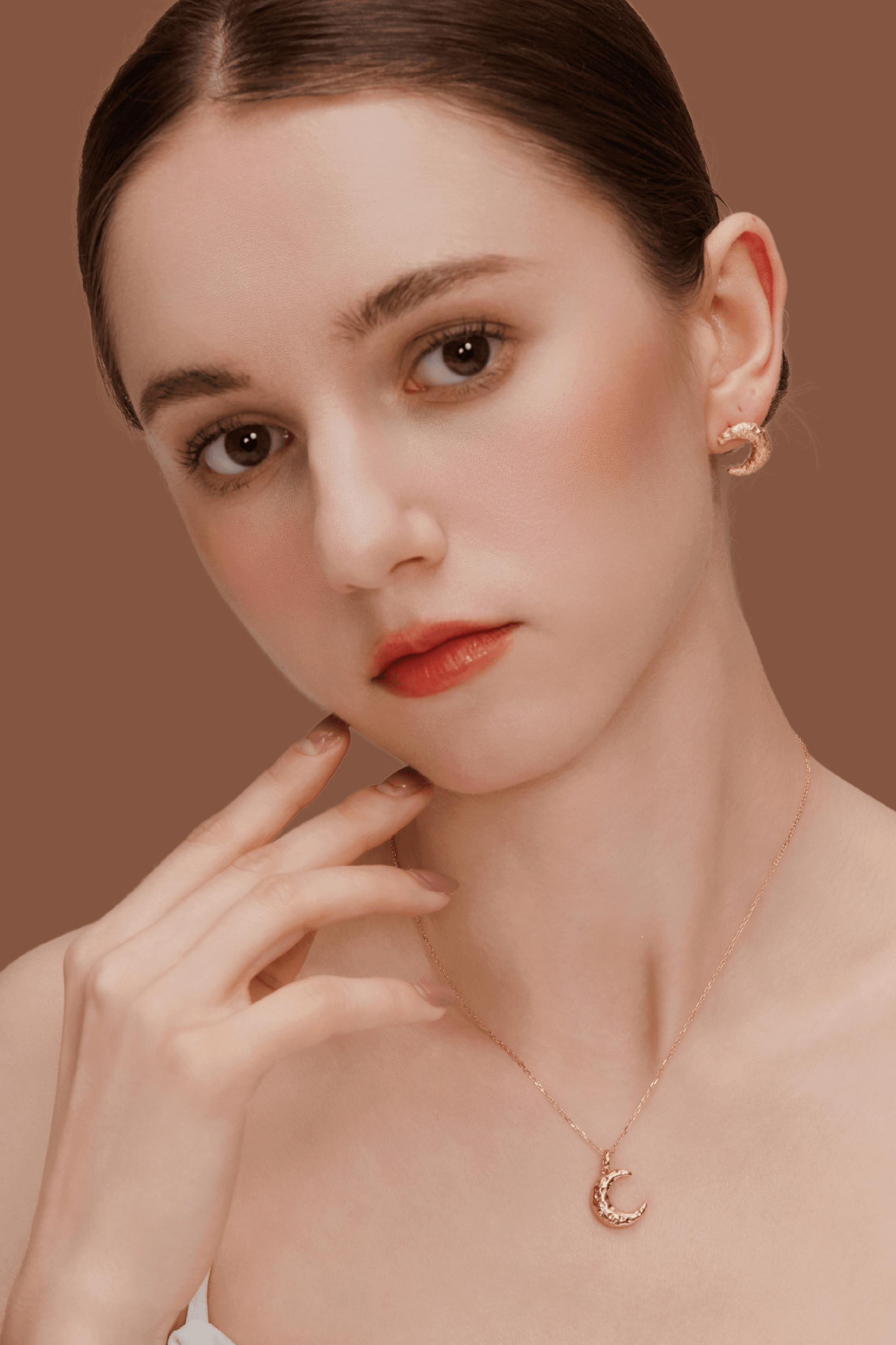 Model wearing SUIHE Jewelry's Moon Necklace with crescent moon pendant in gold, representing intuition and feminine energy.