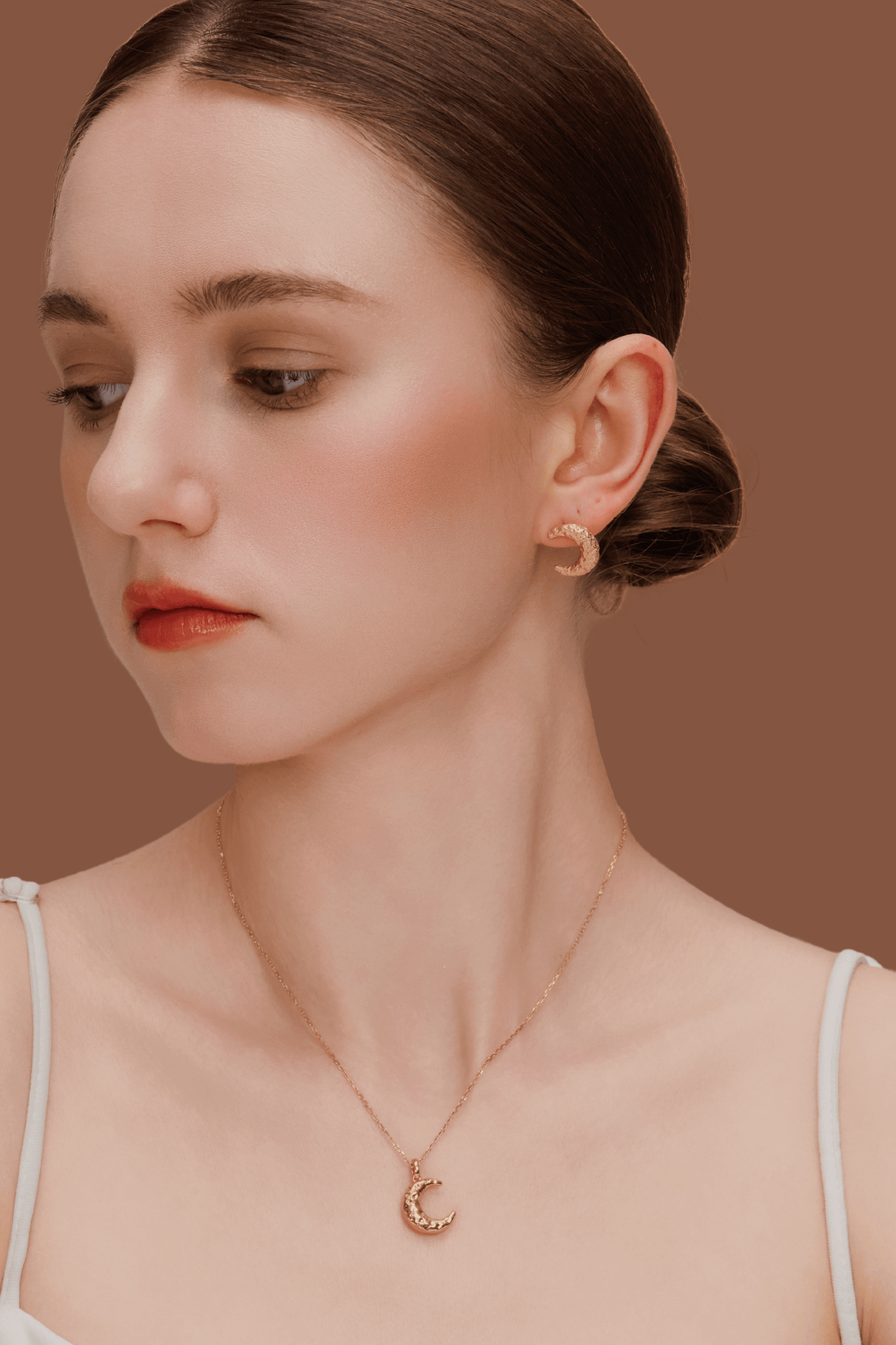 Woman wearing SUIHE Jewelry "Moon" Necklace and matching crescent moon earrings in gold plating, showcasing celestial elegance.