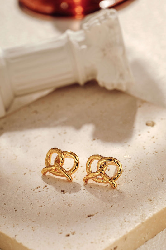 "SUIHE Jewelry Pretzel Stud Earrings in 18k Gold Vermeil over Sterling Silver, elegant design on marble background"