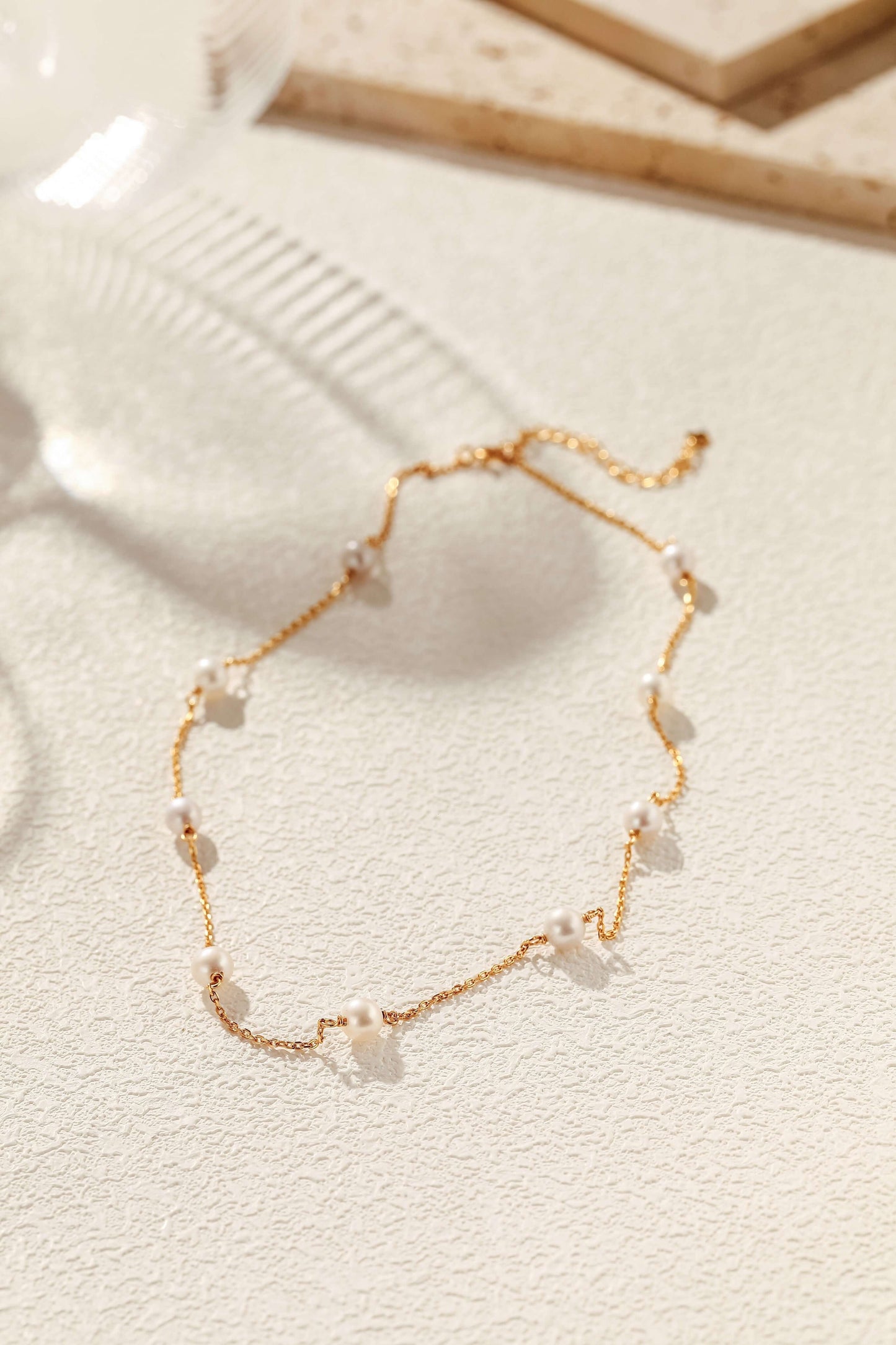 Elegant "Starry Night" Akoya Pearl Necklace by SUIHE Jewelry, showcasing delicate pearls on refined gold chain, capturing celestial beauty.