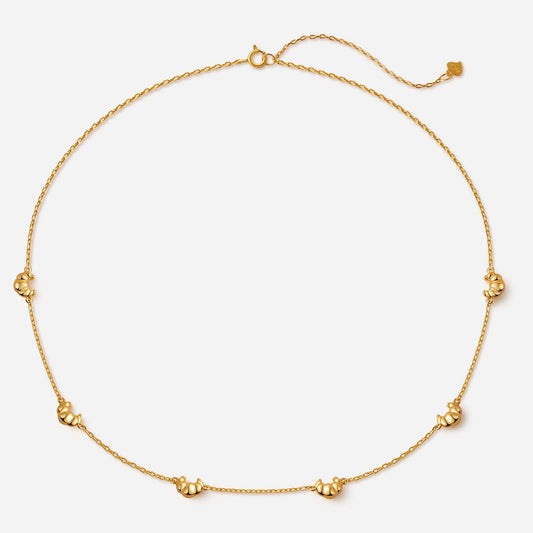 18k gold vermeil Croissant Mini Charm Necklace by SUIHE Jewelry, featuring dainty croissant-shaped charms on a delicate chain.