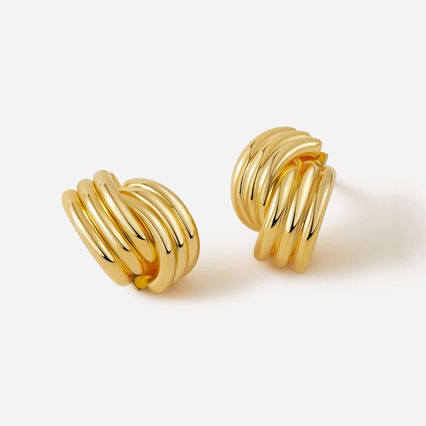 Gold-plated Wave Earrings by SUIHE Jewelry, featuring modern sculptural design with layered curves. Perfect for chic and formal looks.