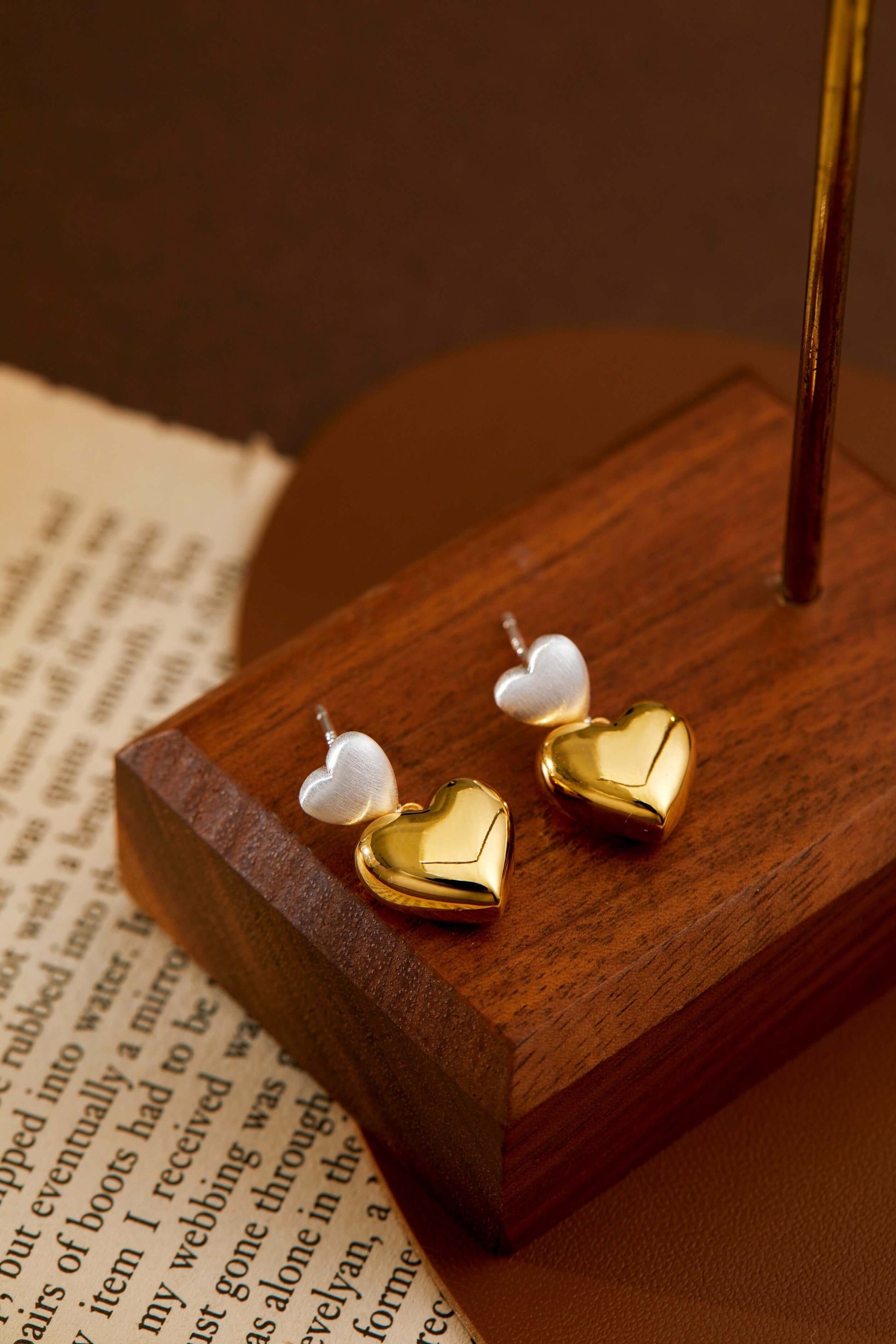 SUIHE Jewelry Amour Double Heart Earrings in silver and gold, featuring a dual-heart design blending brushed silver and polished gold.