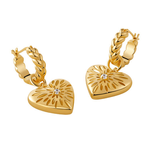 Gold-tone "Amour" pendant earrings by SUIHE Jewelry featuring heart charms with starburst designs and crystal centerpieces.