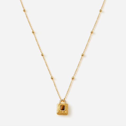Gold-plated necklace with lock pendant featuring Tiger Eye stone by SUIHE Jewelry, symbolizing resilience and grounding energy.
