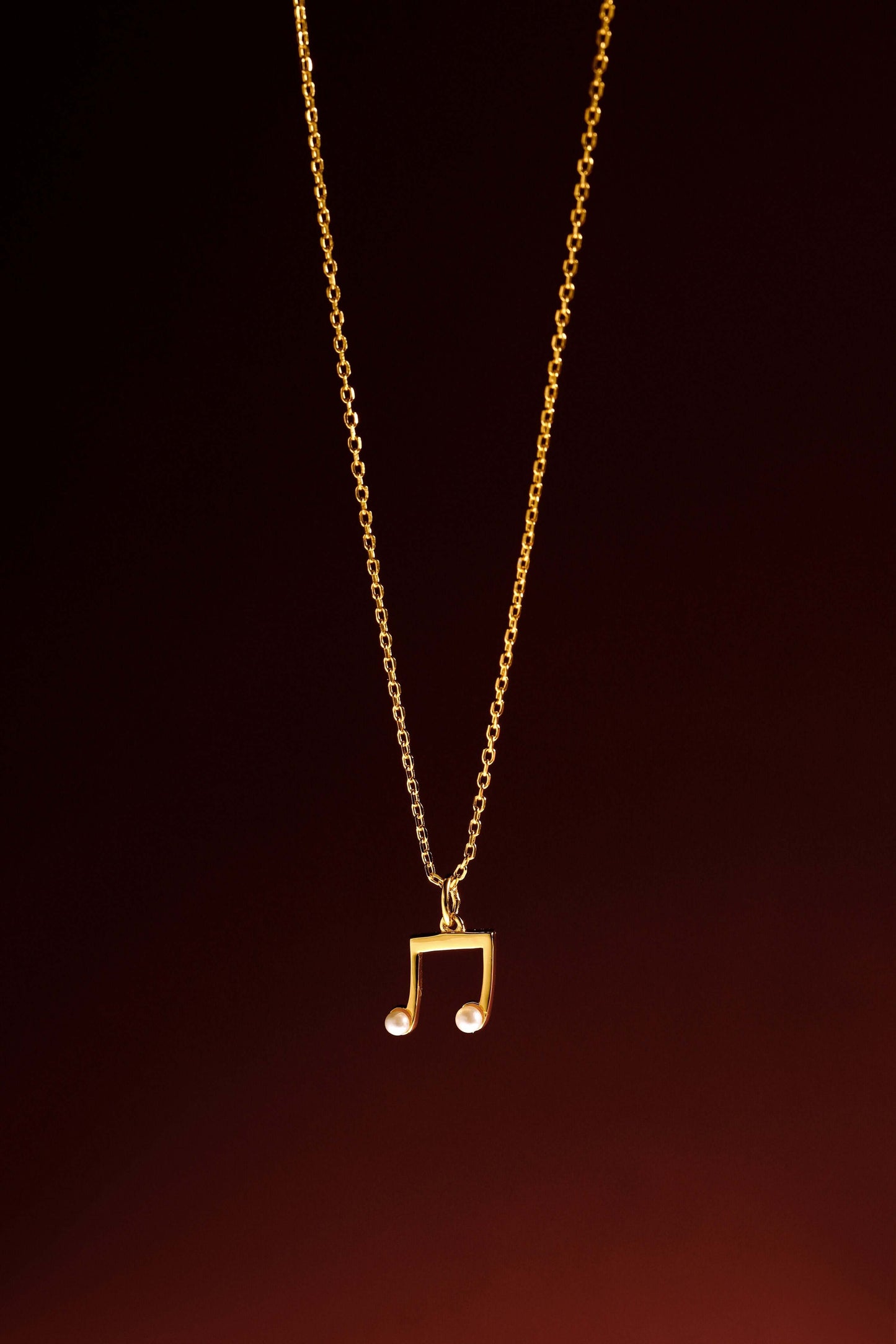 "Melody" Necklace in 18k Gold Vermeil with Pearls by SUIHE Jewelry, showcasing elegant and timeless design on a dark background.