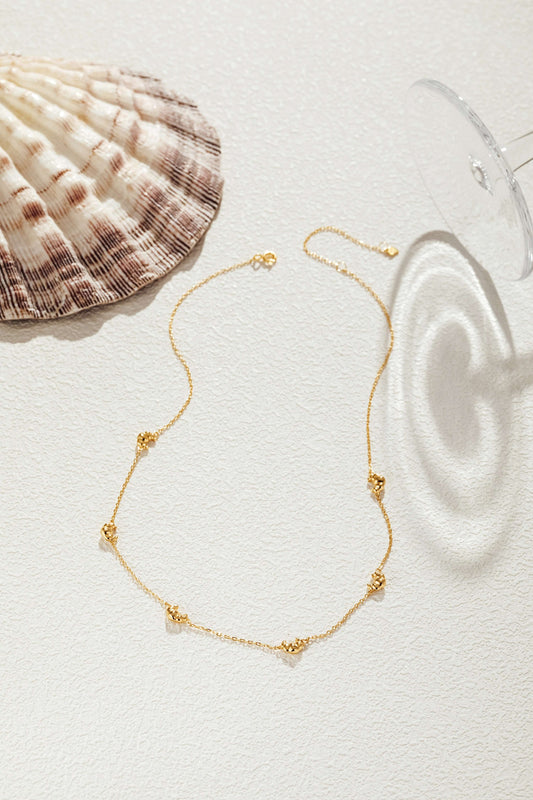 18k gold vermeil Croissant Mini Charm Necklace by SUIHE Jewelry, featuring delicate croissant-shaped charms on a dainty chain.