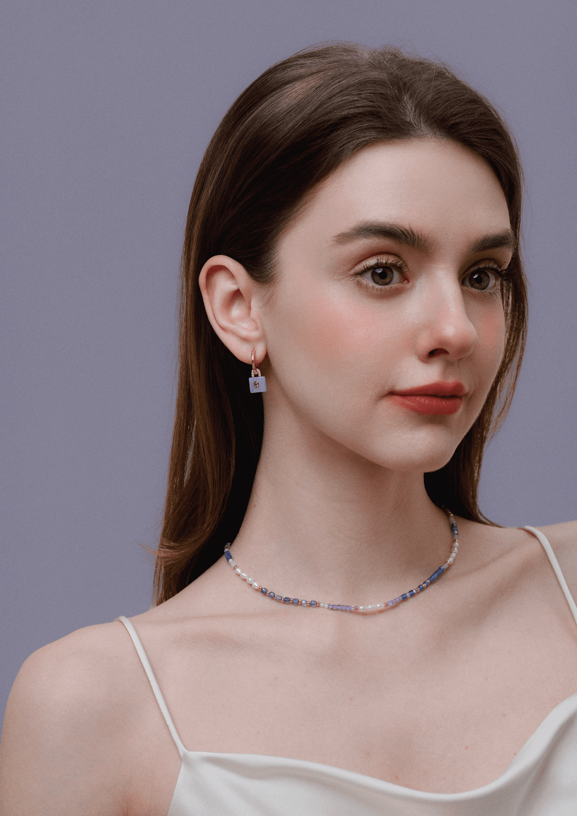 Woman wearing Ocean Natural Gemstone Necklace with pearls and colored gemstones by SUIHE Jewelry.