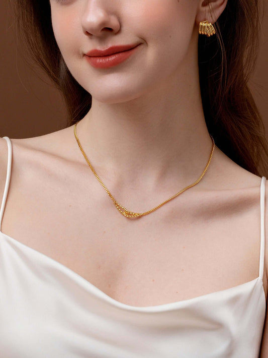 Woman wearing Twist Gold Chain Necklace by SUIHE Jewelry, featuring a refined twisted design and elegant simplicity.