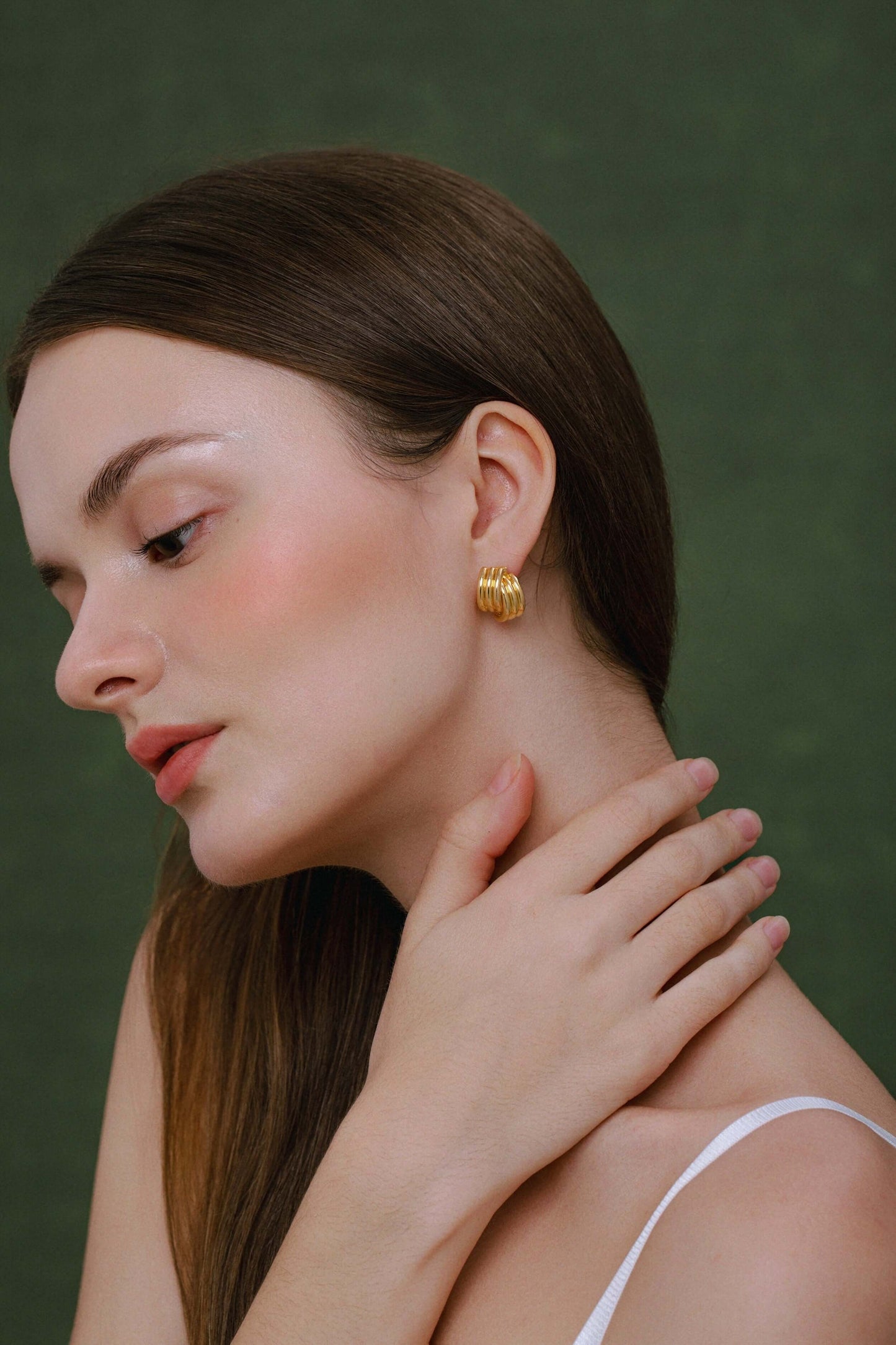 Model wearing gold SUIHE Jewelry Wave Earrings, showcasing bold design with layered curves for elegant style.