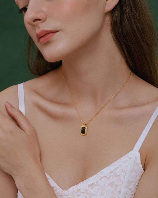 Woman wearing "Nocturne" Black Onyx Rectangle Necklace by SUIHE Jewelry, set in 18k Gold Vermeil over sterling silver.