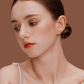 Model wearing SUIHE Jewelry Tennis Necklace with gold-plated tennis racket pendant, showcasing sporty chic elegance.