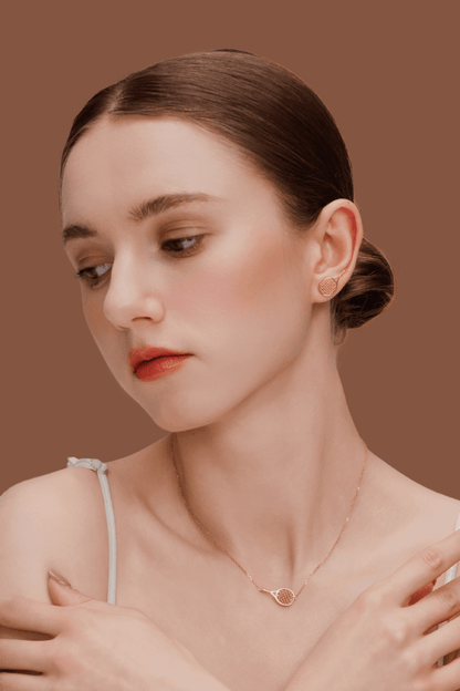 Model wearing SUIHE Jewelry Tennis Necklace with gold-plated tennis racket pendant, showcasing sporty chic elegance.