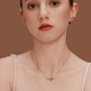 Woman wearing SUIHE Jewelry's Tennis Necklace with gold-plated tennis racket pendant, showcasing sporty chic elegance.