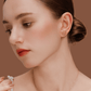 Model wearing SUIHE Jewelry Tennis Necklace with gold-plated tennis racket pendant, showcasing sporty chic elegance.