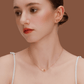 Model wearing SUIHE Jewelry Tennis Necklace with gold-plated tennis racket pendant, showcasing sporty chic elegance.