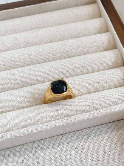 "Nocturne" Black Onyx Square Ring in 18k Gold Vermeil by SUIHE Jewelry displayed on a fabric jewelry holder.