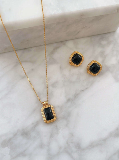 Nocturne black onyx rectangle necklace with matching earrings in 18k gold vermeil over sterling silver by SUIHE Jewelry on marble.