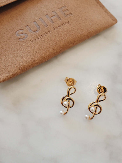 SUIHE Jewelry Aria Stud Earrings in 18k Gold Vermeil with Sterling Silver, featuring pearl accents, displayed on a marble surface.
