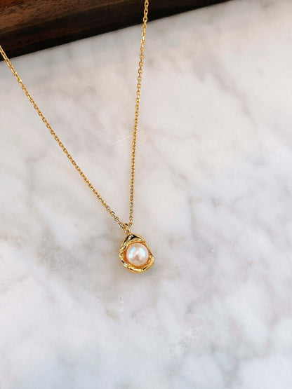 Elysian freshwater pearl necklace in 18k gold vermeil over sterling silver by SUIHE Jewelry, displayed on a white marble surface.