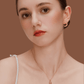 Woman wearing SUIHE Jewelry's "Moon" Necklace in gold with crescent moon pendant, symbolizing intuition and feminine energy.