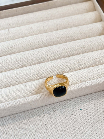 SUIHE Jewelry "Nocturne" Black Onyx Square Ring in 18k Gold Vermeil displayed on a beige jewelry tray.