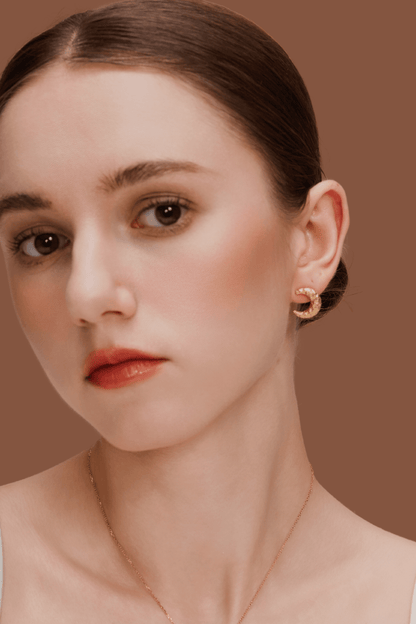 Model wearing gold-plated crescent Moon Earrings by SUIHE Jewelry showcasing textured, sculptural design for celestial and dreamer style.