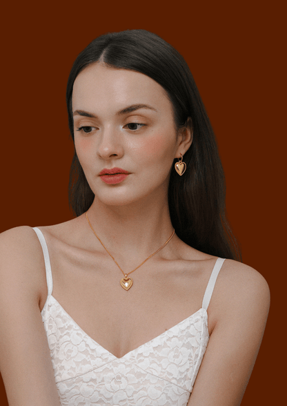 Woman wearing Adore Heart Charm Hoop Earrings and necklace by SUIHE Jewelry