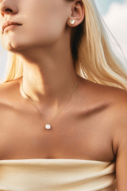 Model wearing SUIHE Jewelry 'Moonlight' Mother-of-Pearl Stud Earrings and necklace in gold vermeil, showcasing elegant minimalist design.