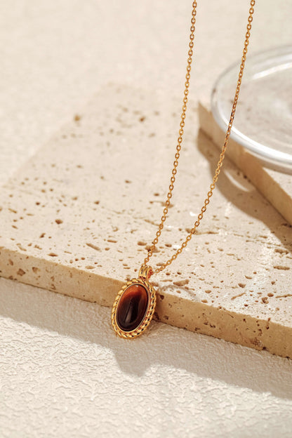 Amber necklace with Tiger's Eye stone and 18k gold vermeil by SUIHE Jewelry. Elegant charm measures 17mm x 12mm on adjustable chain.