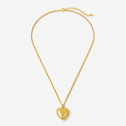 Gold-tone heart charm necklace with beaded detailing by SUIHE Jewelry, epitomizing love and elegance. Perfect romantic accessory.