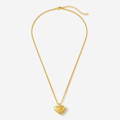 SUIHE Jewelry Amour Heart Pendant Necklace in gold, showcasing a sleek and modern heart design on a delicate chain.