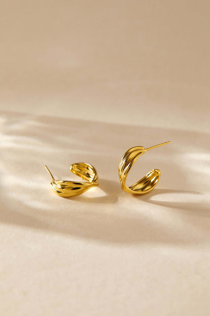 Wavelet Hoop Earrings by SUIHE Jewelry, featuring gold wave-inspired design, reflecting light for a modern, elegant look.