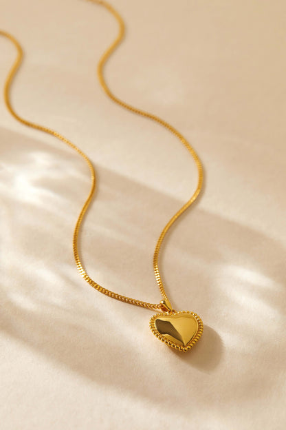 Gold-tone heart charm necklace with beaded detailing by SUIHE Jewelry, elegant and romantic accessory on a sleek chain.