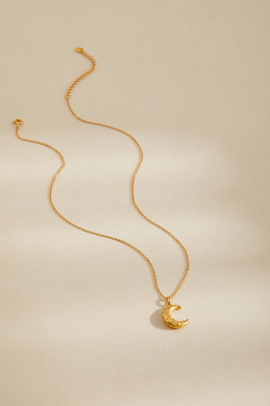 Gold-plated crescent moon necklace by SUIHE Jewelry, symbolizing intuition and feminine energy with an adjustable fine chain.