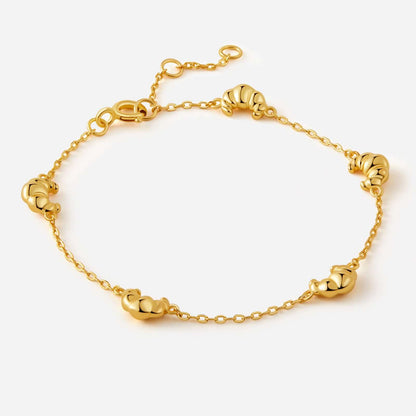 Gold-plated Croissant Mini Charm Bracelet by SUIHE Jewelry featuring delicate croissant charms on a dainty chain for elegant layering.