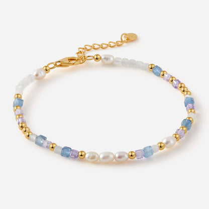 SUIHE Jewelry Ocean Natural Gemstone Bracelet with blue, lavender, white stones and gold-plated beads on a white background.