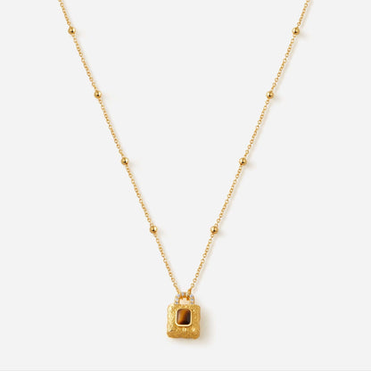 Gold-plated necklace with lock pendant featuring Tiger Eye stone by SUIHE Jewelry, symbolizing resilience and grounding energy.