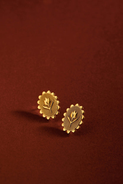 Elegant 'Golden Tulip' earrings by SUIHE Jewelry in 18k Gold Vermeil showcasing tulip motifs on a rich brown background.