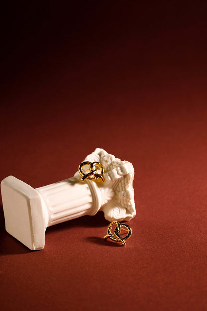 "Pretzel" stud earrings by SUIHE Jewelry in 18k gold vermeil on a white ornamental backdrop, exuding elegance and sophistication.