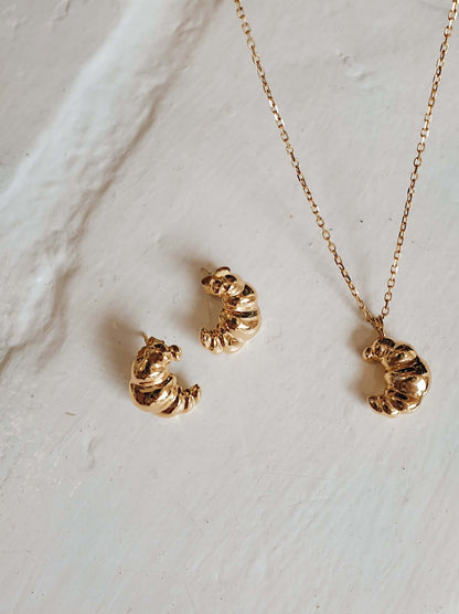 18k Gold Vermeil "Croissant" Necklace by SUIHE Jewelry, inspired by Parisian elegance, featuring a textured croissant charm on a chain.