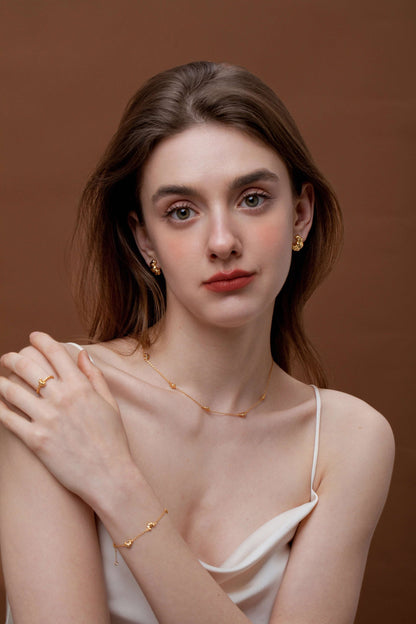 Model wearing SUIHE Jewelry "Croissant" Mini Charm Necklace in 18k gold vermeil, showcasing dainty French-inspired elegance.