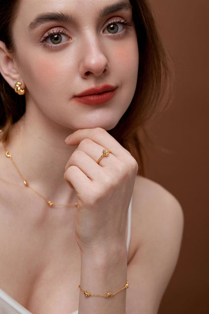 Woman wearing SUIHE Jewelry Croissant Open Cuff Ring with matching gold accessories, showcasing elegance and style.