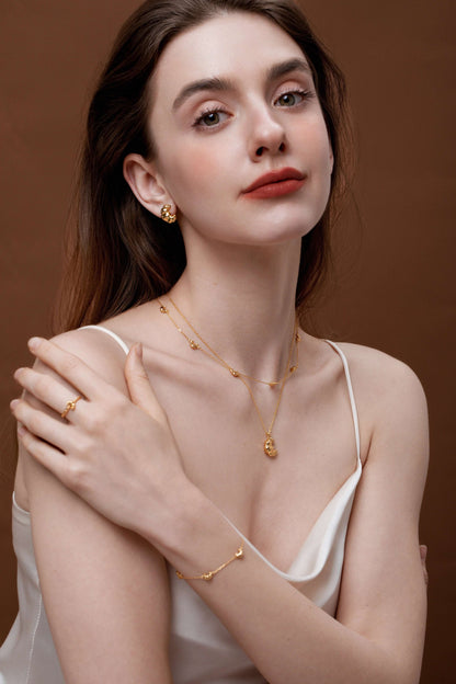 Woman wearing SUIHE Jewelry Croissant Mini Charm Necklace, 18k gold vermeil, showcasing elegant French-inspired design