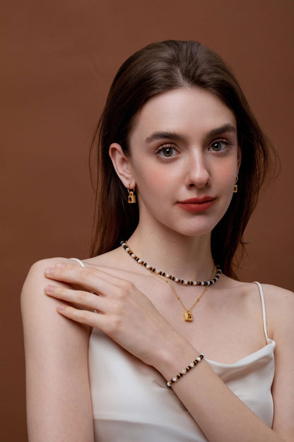 Woman wearing SUIHE Jewelry Tiger Eye Stone Necklace and Earrings set