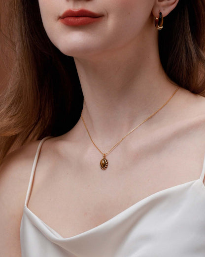Woman wearing SUIHE Jewelry Mocha Tiger Eye Stone Necklace with gold vermeil chain and tiger’s eye pendant