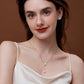 Elegant woman wearing SUIHE Jewelry 'Allure' Mother-Of-Pearl and Pearl Drop Necklace with adjustable chain, perfect for layering.
